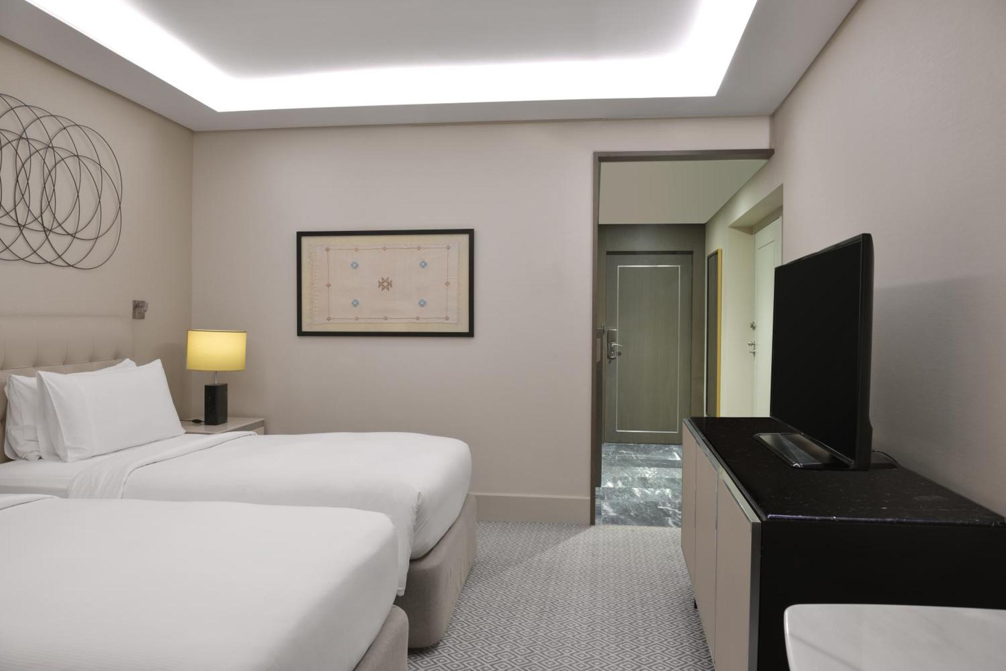 Hilton Tanger City Center Exteriör bild A room at the hotel
